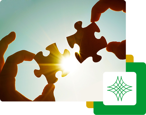 Photo depicting two hands, each holding a piece of a puzzle, fitting them together